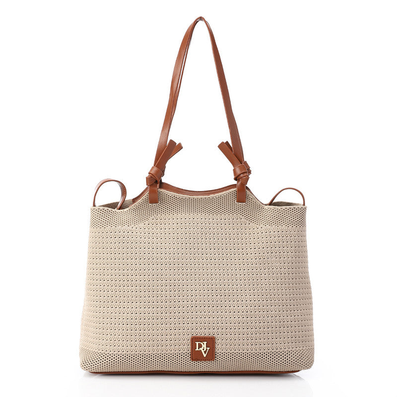 Beige woven handbag with brown leather straps and handle on a white background