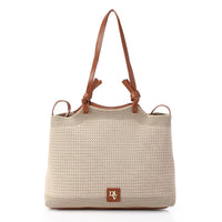 Beige woven handbag with brown leather straps and handle on a white background