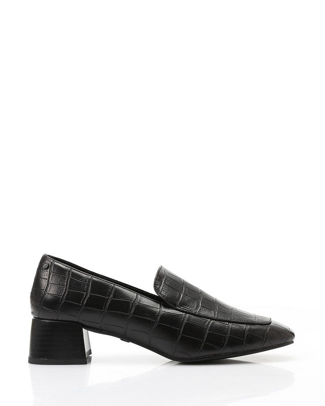 Black crocodile-patterned shoes on a white background