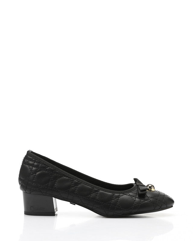 Black shoe with a bow on a white background