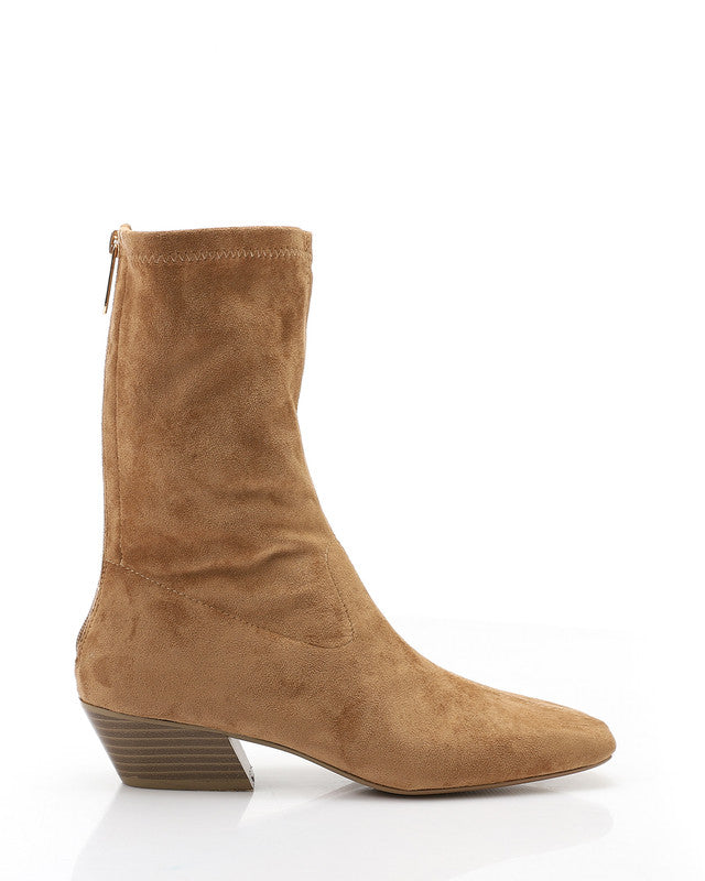 Tan suede boot on a white background