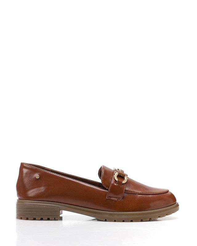 Brown leather loafer with gold buckle on a white background